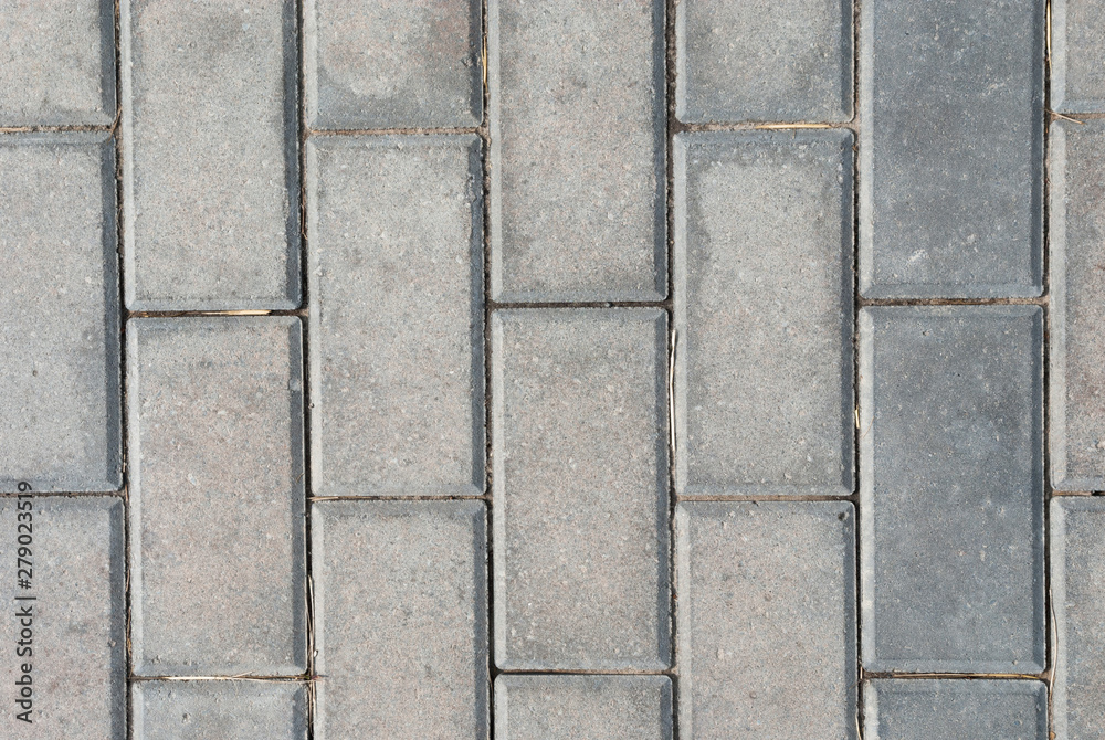 Obraz premium Brick pavement tile, top view. Light sidewalk, pavement texture