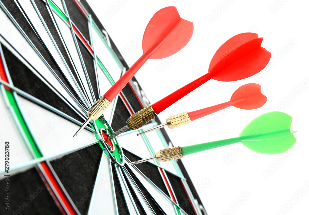Dart board with color arrows hitting target on white background, closeup Dart board with color arrows hitting target on white background, closeup
