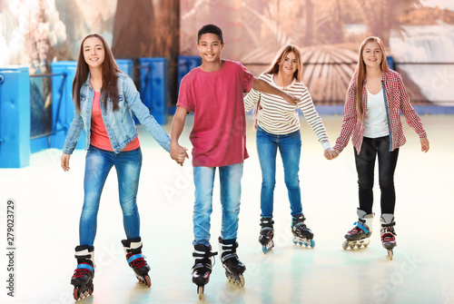 Group of teenagers at roller skating rink