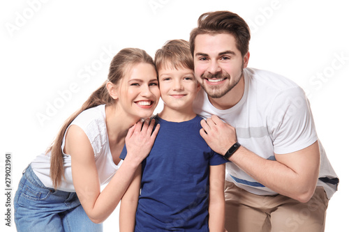Portrait of couple with child on white background. Happy family