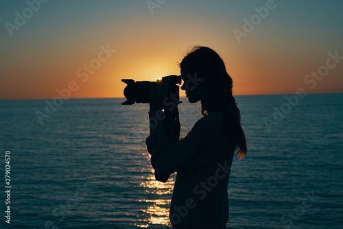 silhouette of photographer at sunset