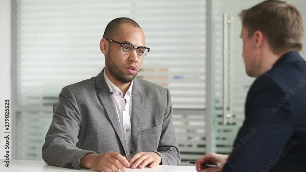 Male african candidate shake hand of hr manager get hired Male african candidate shake hand of hr manager get hired