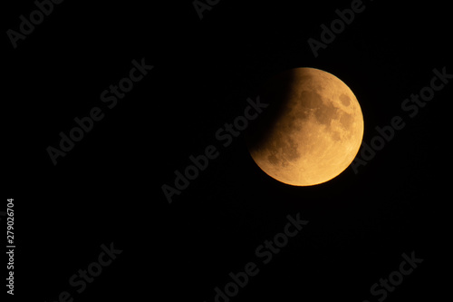 July 16, 2019, Poland. Partial eclipse of the moon in the sky