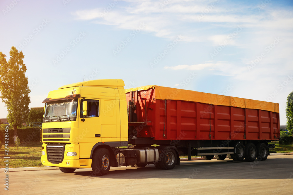 Modern bright truck parked on country road