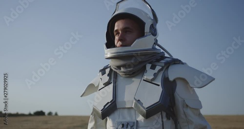 Astronaut opening helmet on Mars photo