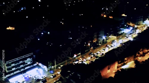 Aerial fly over a busy street packed with parked and moving cars Aversa, Teverola, Province of Caserta, Campania, Italy.​ Concept: urban life,lifestyle,night lights