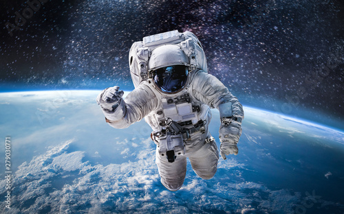 Canvas Print Astronaut in the outer space over the planet Earth