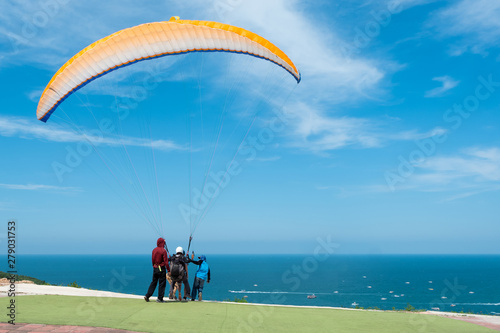 Paramotors flying above the sea beach