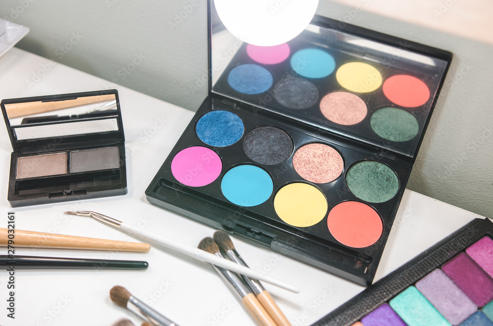 Beauty tools palettes collection. Brush on white table Beauty tools palettes collection. Brush on white table