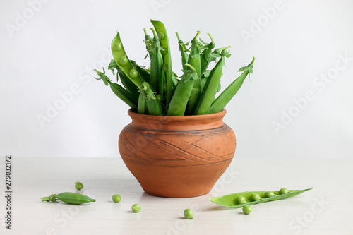 green peas in pods in a pot