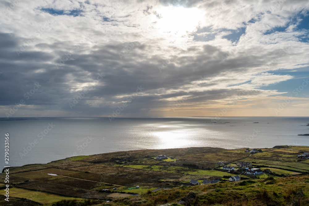 Sun reflecting on Atlantic ocean, view from the Sky Road, near Clifden, Galway, Ireland