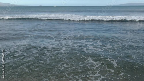 Foamy ocean waves front view