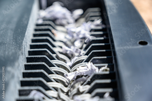 closeup view of office paper shredder teeth 