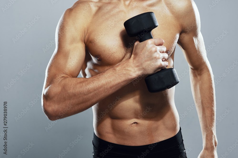 Naklejka premium young man lifting weights