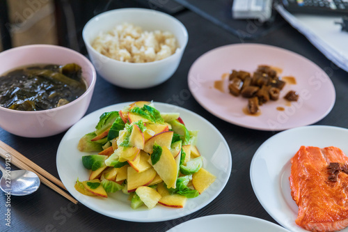 Small cabbage salad with sliced peach and various side dishes, Korean food