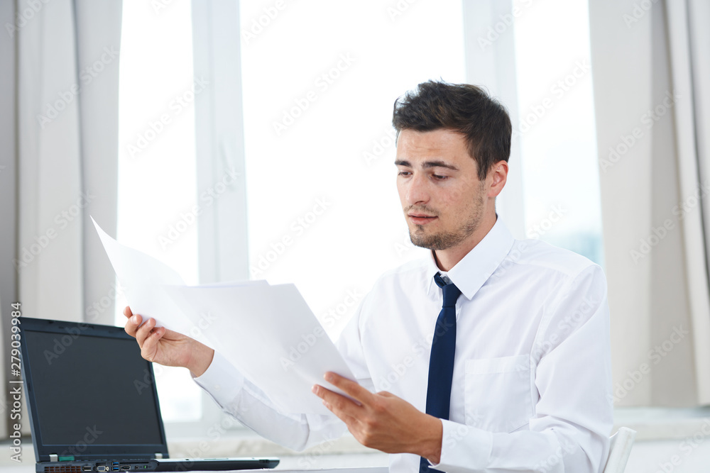 businessman working on his laptop in office businessman working on his laptop in office