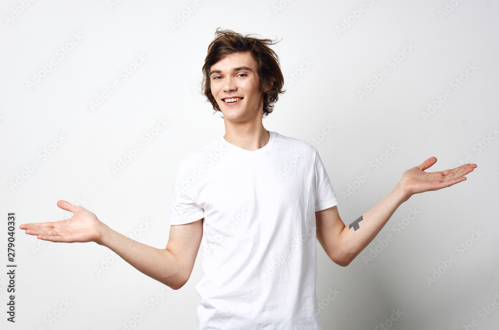 young man pointing at copyspace young man pointing at copyspace