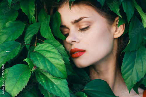 Beautiful woman green leaves nature garden