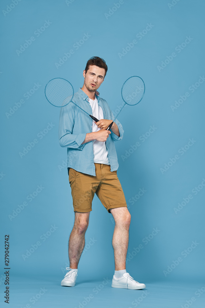 man with tennis racket and ball