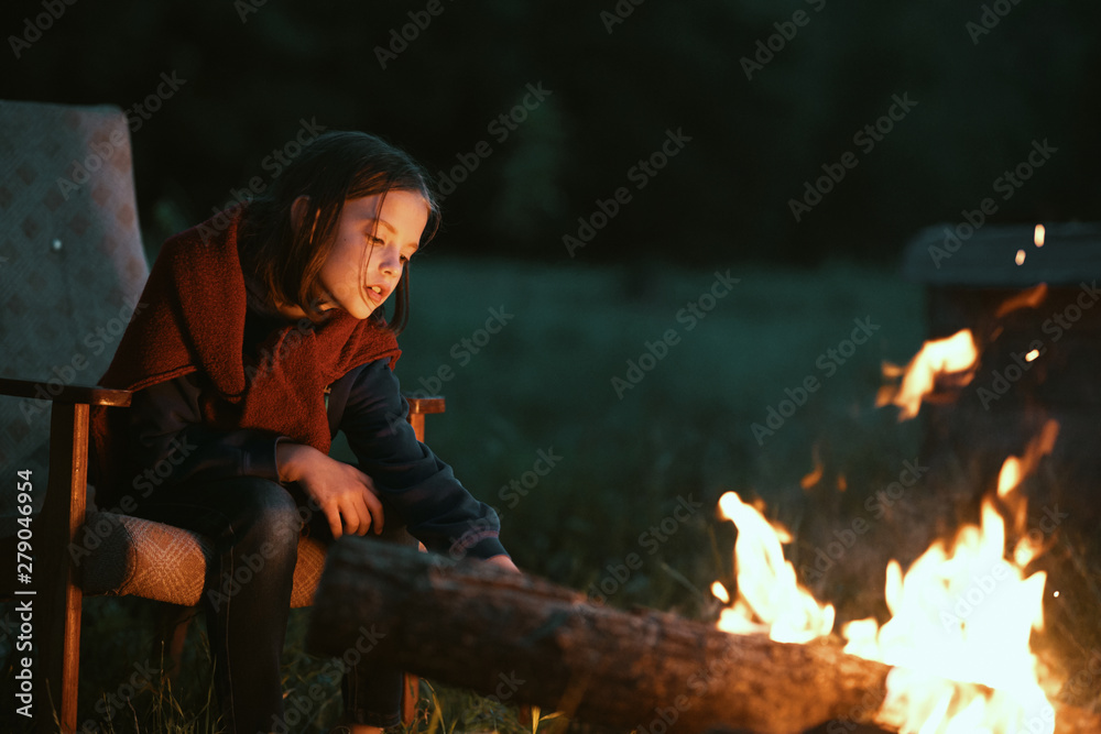 man sitting in front of fire