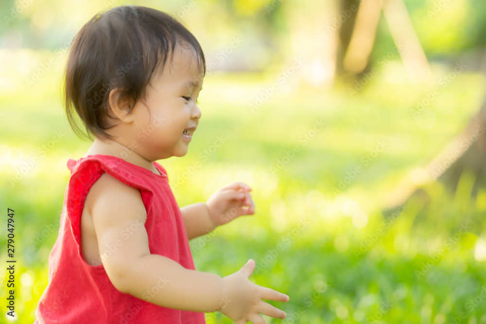 Portrait face of cute asian little girl and child happiness and fun in the park in the summer, smile and happy from asia kid and relax in the garden, lifestyle childhood concept. Portrait face of cute asian little girl and child happiness and fun in the park in the summer, smile and happy from asia kid and relax in the garden, lifestyle childhood concept.