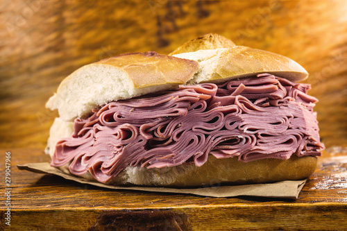 Traditional mortadella sandwich of Municipal Market (Mercado Municipal) in Sao Paulo, Brazil. Great bread snack with mortadella. photo