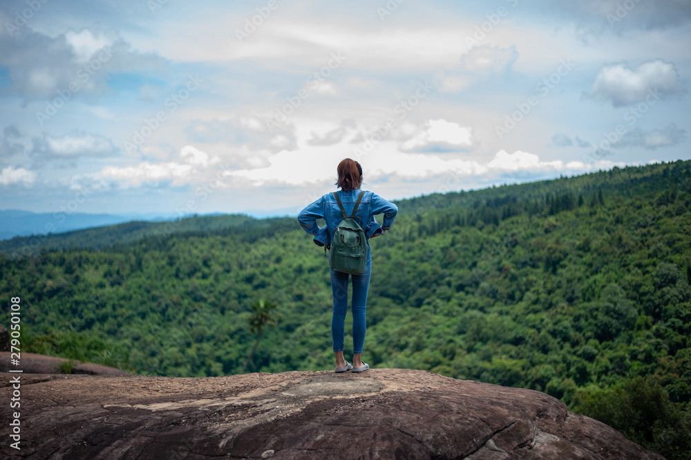 man on top of mountain