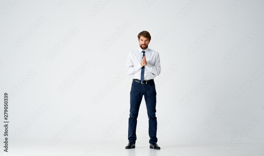businessman standing in front of a wall businessman standing in front of a wall