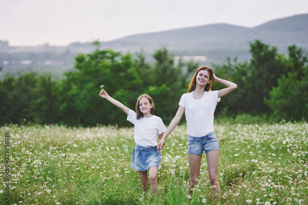 mother and daughter having fun in the field