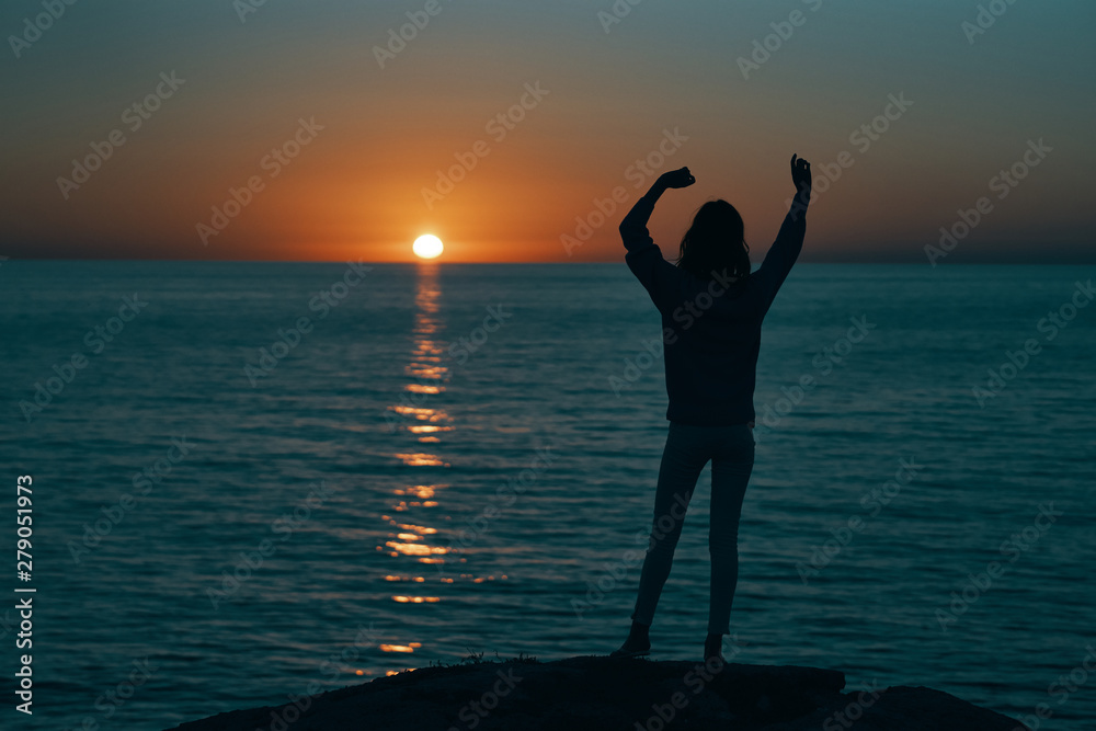 silhouette of a woman at sunset