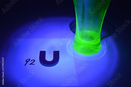 Uranium glass and uranium atomic number under black ligh photo