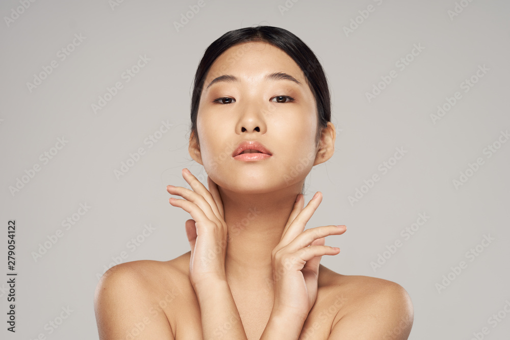 young smiling woman with perfect skin on face looking at camera young smiling woman with perfect skin on face looking at camera