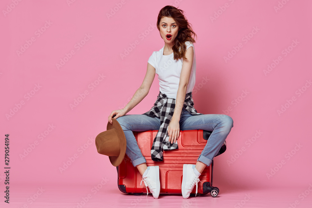 girl in red dress sitting on a chair