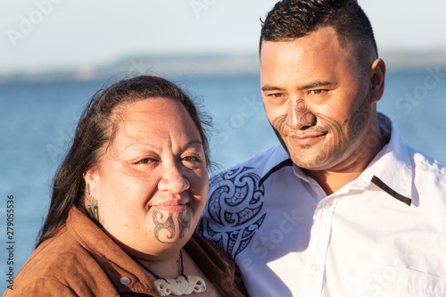 Portrait of an attractive Maori couple taken outdoors