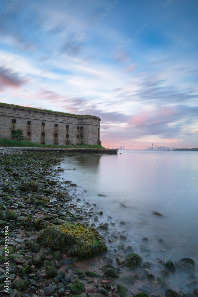 View on Fort Wadsworth at sunset with Manhattan on background long exposure