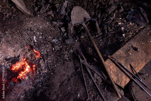 top view of traditional blacksmith furnace with burning fire photo