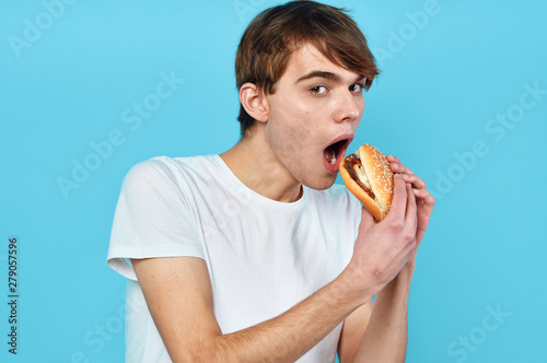 young man eating donut