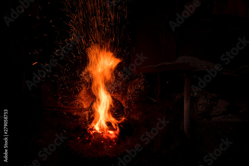 Traditional blacksmith furnace with burning fire