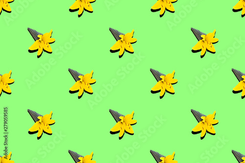 Pattern black ice cream cone with yellow lily flower on green neon background.. © Olga
