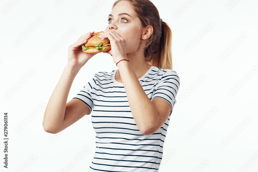 young woman eating salad isolated on white young woman eating salad isolated on white