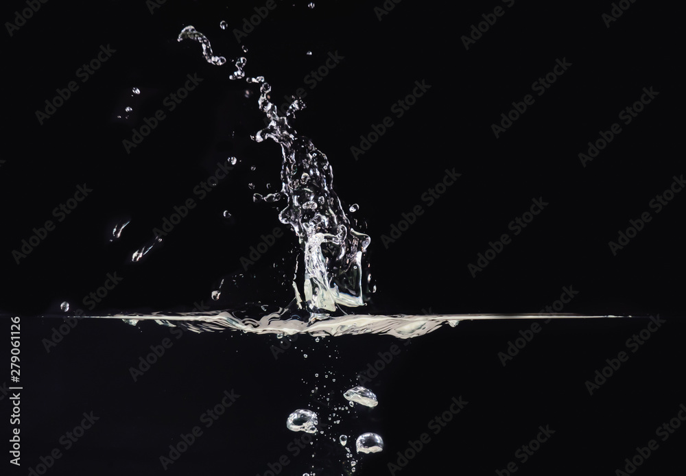 Explosion on water surface isolated on black background, close up view. Water bubbles underwater and in air, black background for overlays design, screen blending mode layer Explosion on water surface isolated on black background, close up view. Water bubbles underwater and in air, black background for overlays design, screen blending mode layer