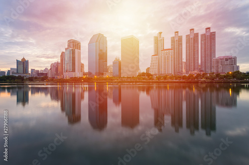 City building with water reflection before sunset