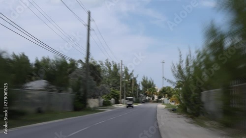 Hyperlapse shot filmed from the backseat of a golf cart in Bimini, Bahamas. Driving very fast around the island. photo