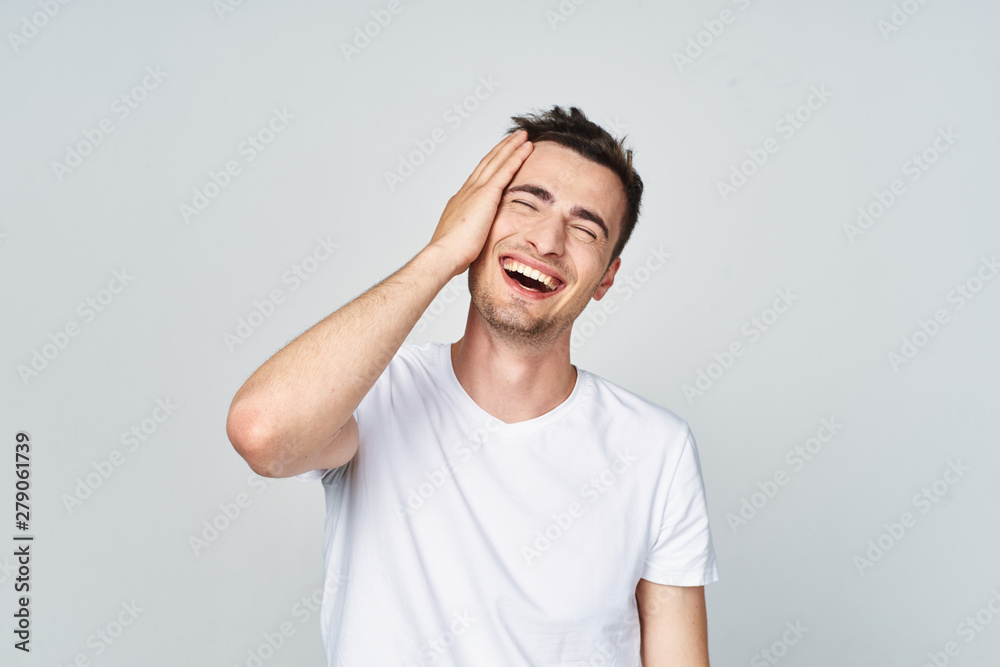 Fototapeta premium portrait of a young man with hands on his head