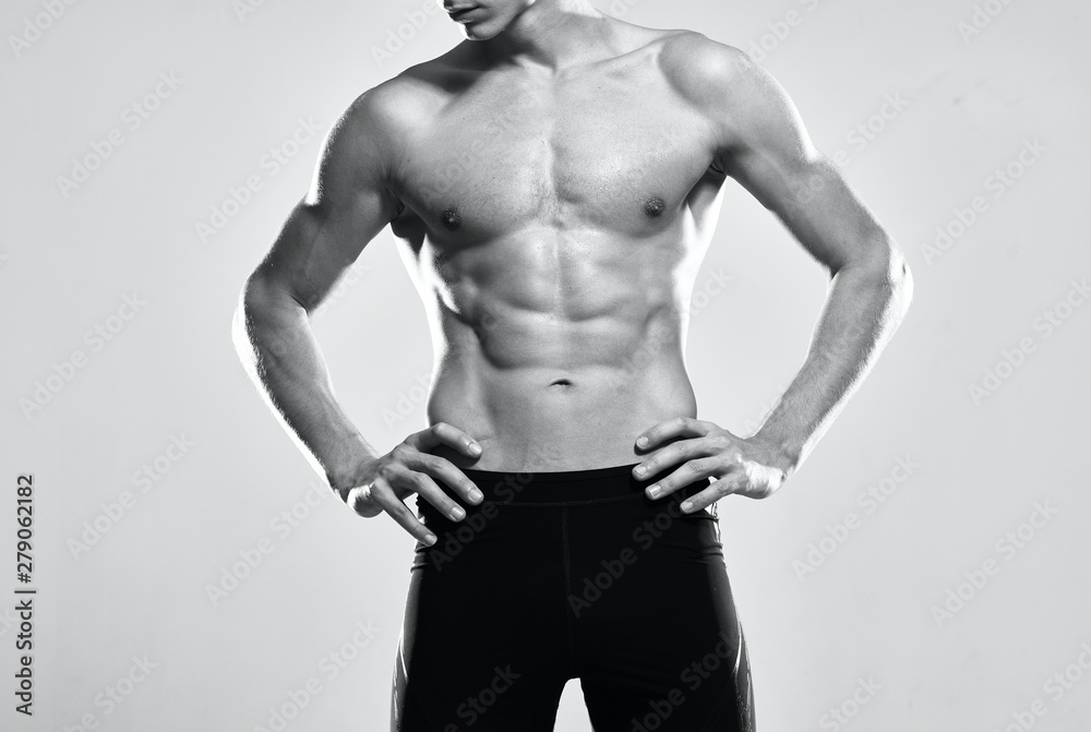 Fototapeta premium man with muscular body isolated on black background