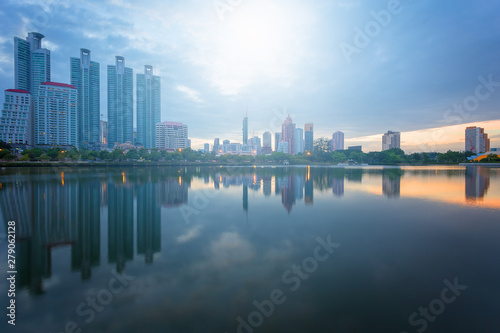 City building with water reflection before sunset