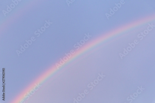 view on rainbow in a blue sky