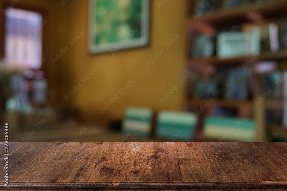 Empty dark wooden table in front of abstract blurred bokeh background of restaurant . can be used for display or montage your products.Mock up for space. Empty dark wooden table in front of abstract blurred bokeh background of restaurant . can be used for display or montage your products.Mock up for space.