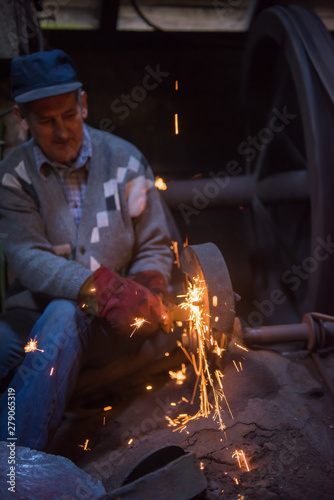 the blacksmith polishing metal products