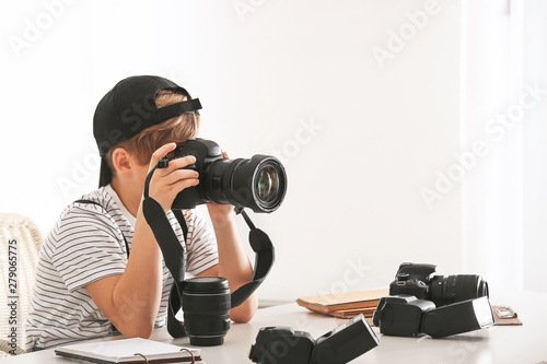 Cute little photographer wi...